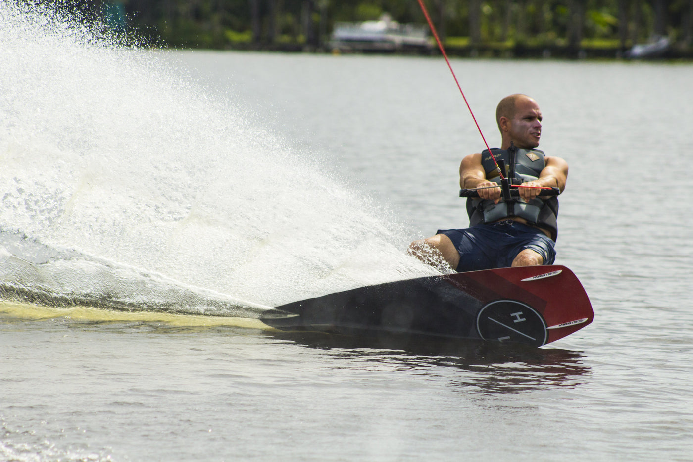 lifestyle of shaun murray wakeboarding out on the open water wearing his signature vest