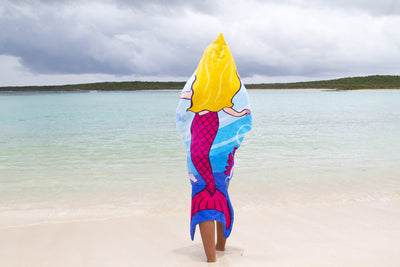 lifestyle shot of girl on the beach using Mermaid Linden Hoodie Towel