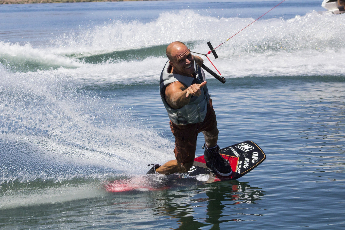 Picture of Shaun Murray wakeboarding giving a Shaka sign 